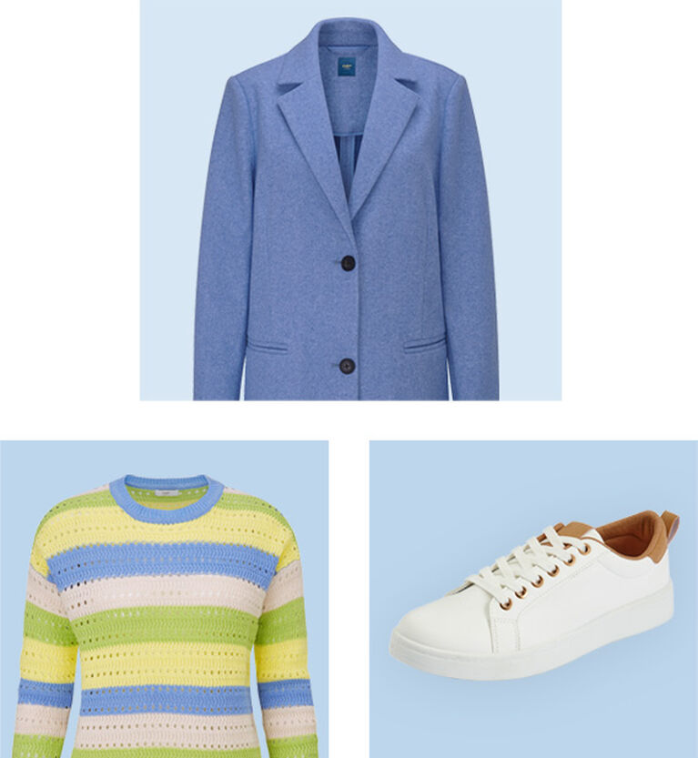 A close-up image of the pastel jumper, blue coat and white trainers against a light blue backdrop