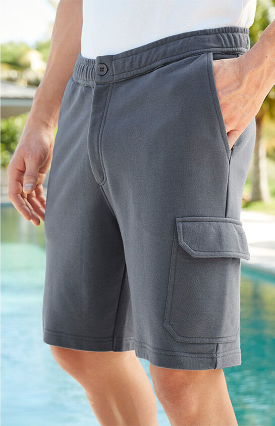 A close-up image of a pair of grey cargo shorts in a 100% cotton material. It has a fully elasticated waistband. 