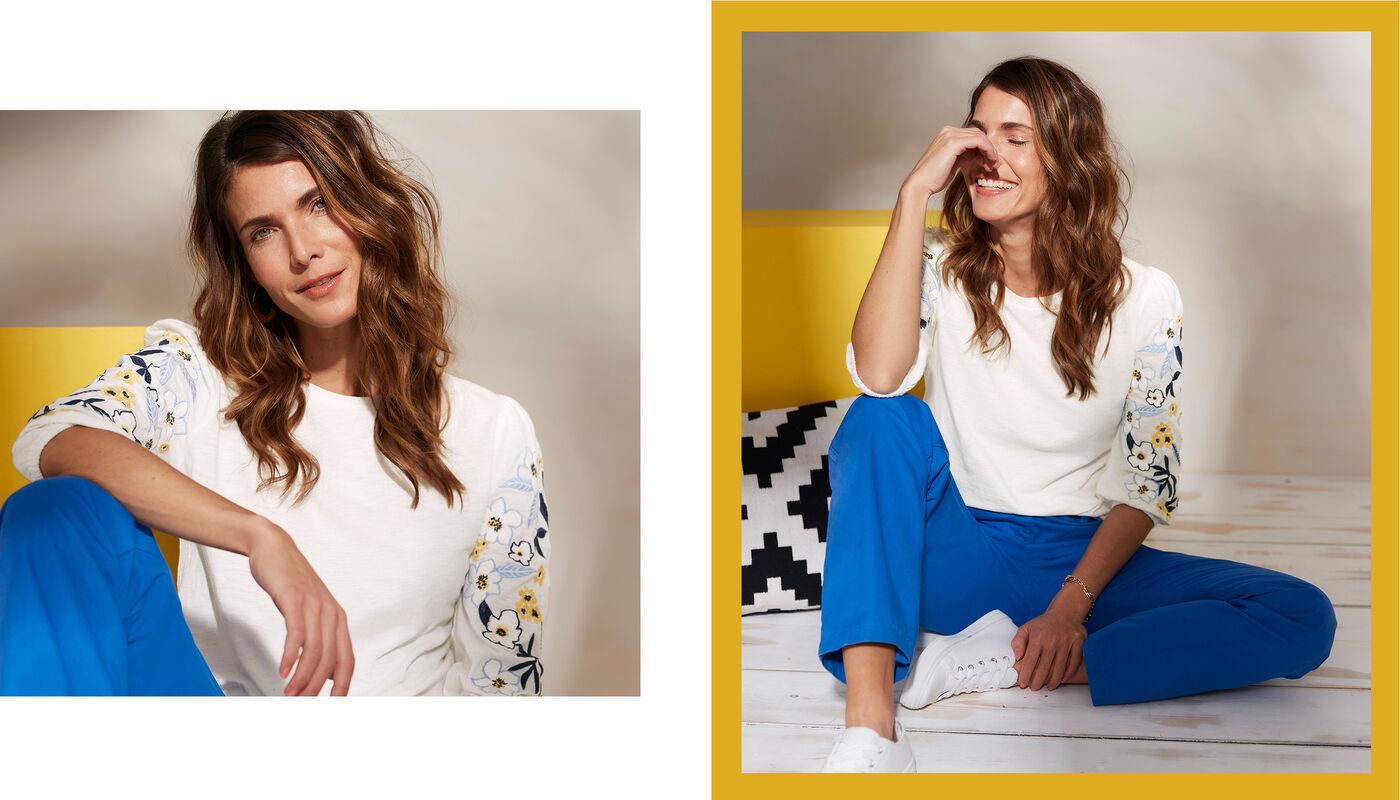 womens blue trousers and white top