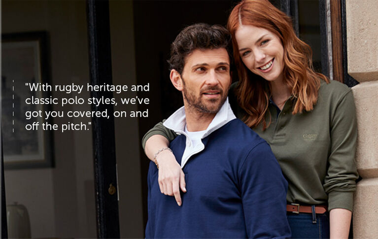 Man and Woman together, embraced, wearing Navy and Green cotton Traders Polo Shirts
