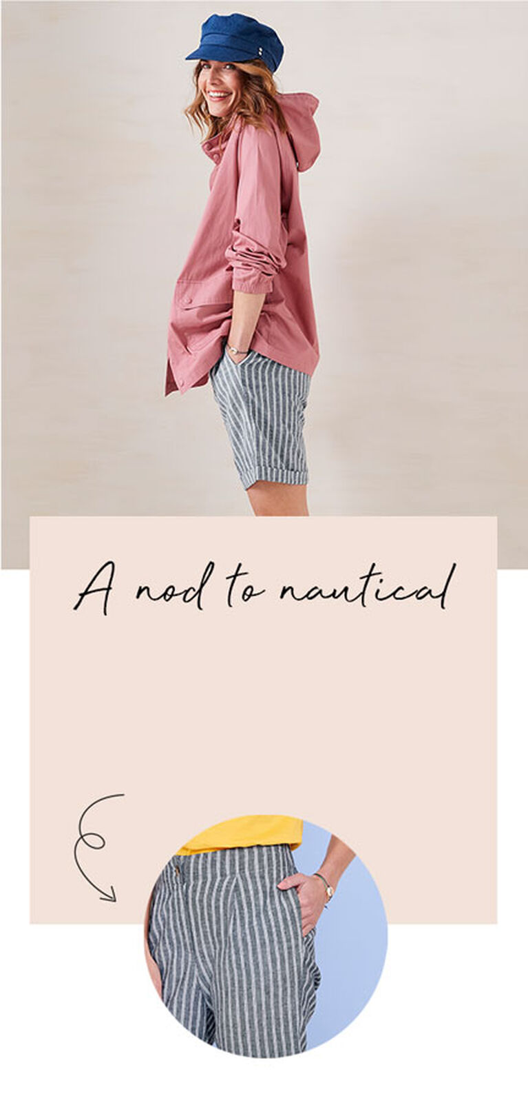 Woman smiling whilst wearing a blue hat, pink weatherproof jacket and striped shorts