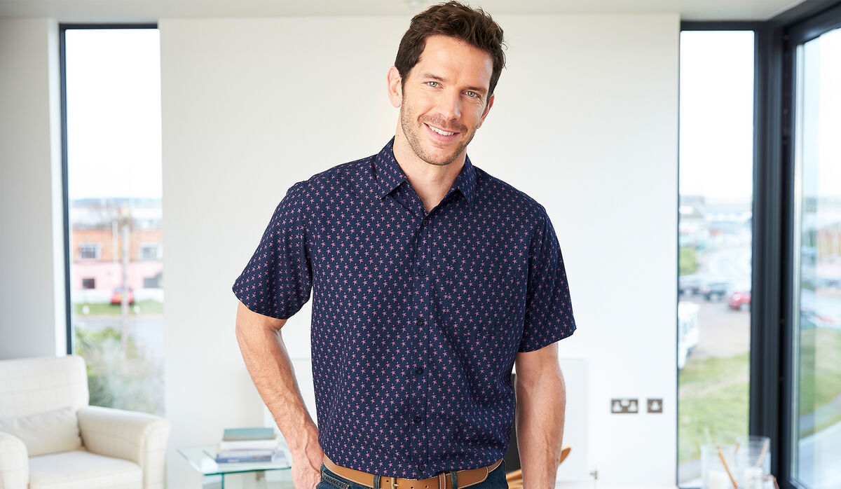 Man wearing Cotton Traders short sleeve soft shirt with goose print pattern