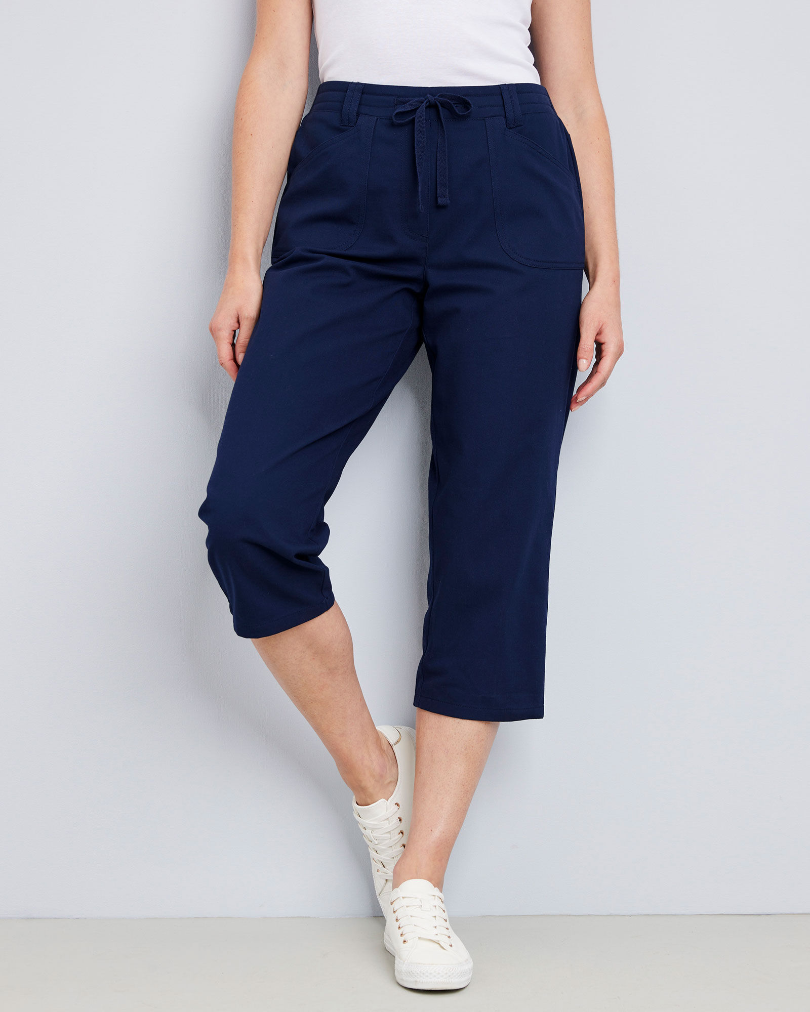 Cropped navy trousers sales